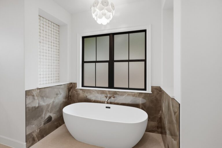 Primary bath with freestanding soaking tub at 2069 Preserve Trail by M2 Luxury Homes in Timberview Preserve