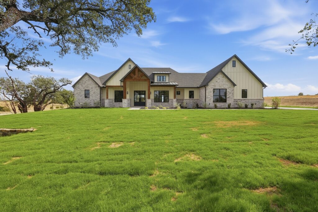 Stone and brick exterior at 2077 Preserve Trail by M2 Luxury Homes in Timberview Preserve