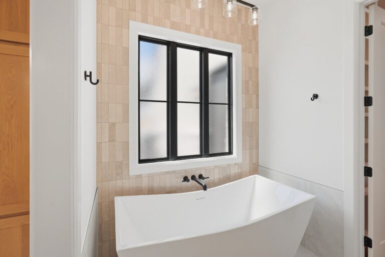 Primary bath with soaking tub at 2077 Preserve Trail by M2 Luxury Homes in Timberview Preserve