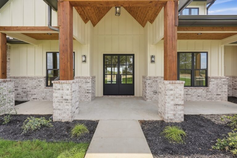 Timber-framed front porch and entry at 2077 Preserve Trail by M2 Luxury Homes in Timberview Preserve