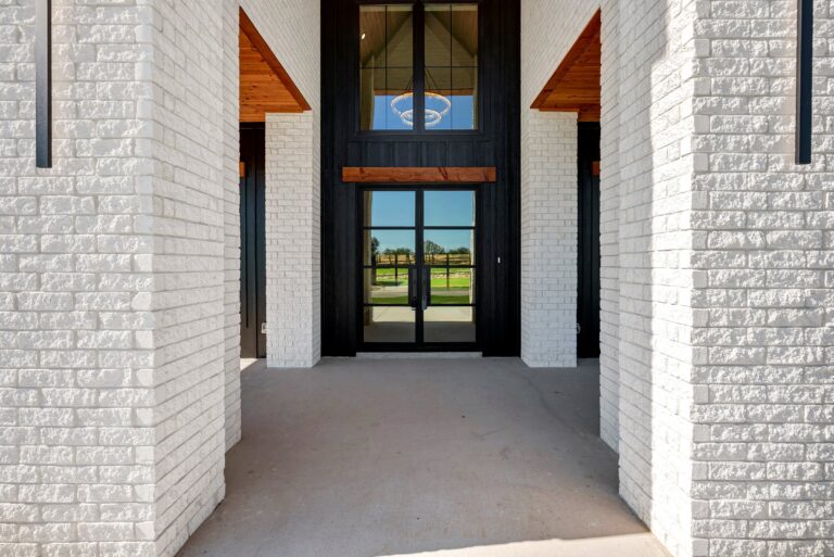 Two-story entry with floor-to-ceiling windows at 519 Royal Santana Run